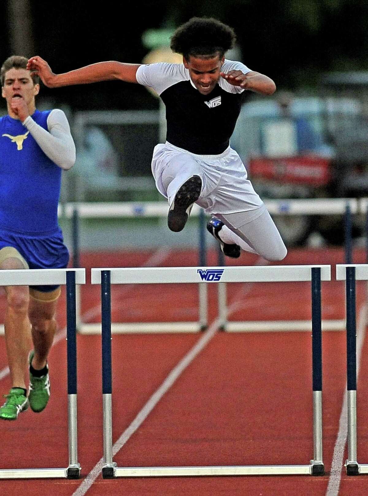 WO-S student J'Marcus Rhodes competes in the boys 300 meter hurdles at the 21-3A district track meet on Thursday, April 11, 2013, in Orange. Photo taken: Randy Edwards/The Enterprise