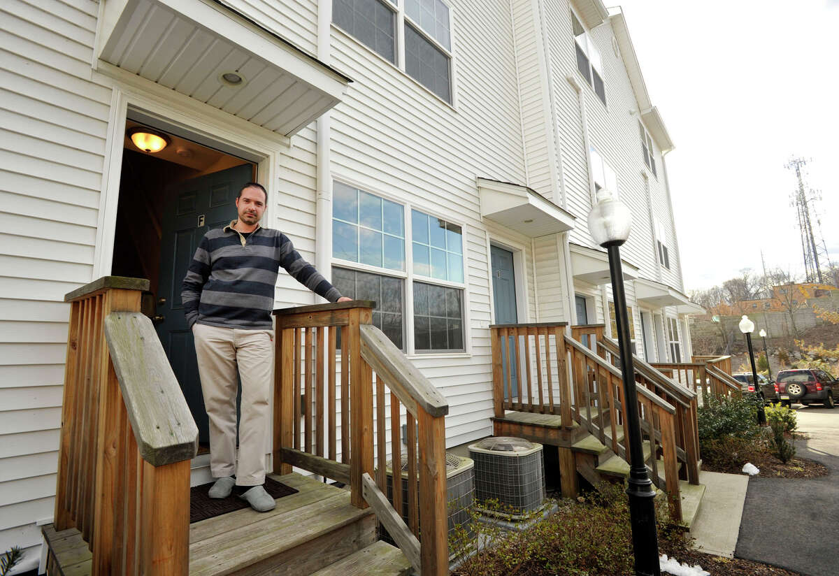 Ross Yachkoff shows off his newly purchased condominium unit in Norwalk on Tuesday, March 26, 2013. He moved into his condo in January. This is Yachkoff's first home purchase.