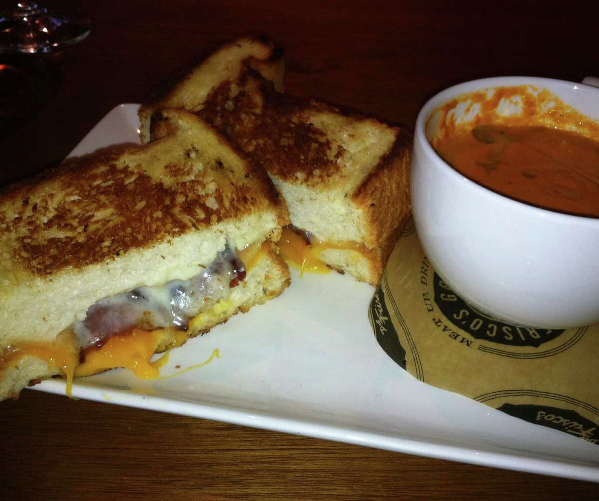 The grilled cheese at Del Frisco's Grille is served with roasted tomato bisque.