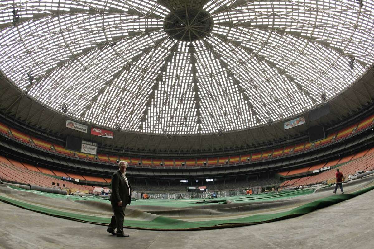 Mark Miller, left, general manger of Reliant Park, lead a media tour of the Reliant Astrodome Tuesday, April 3, 2012, in Houston.