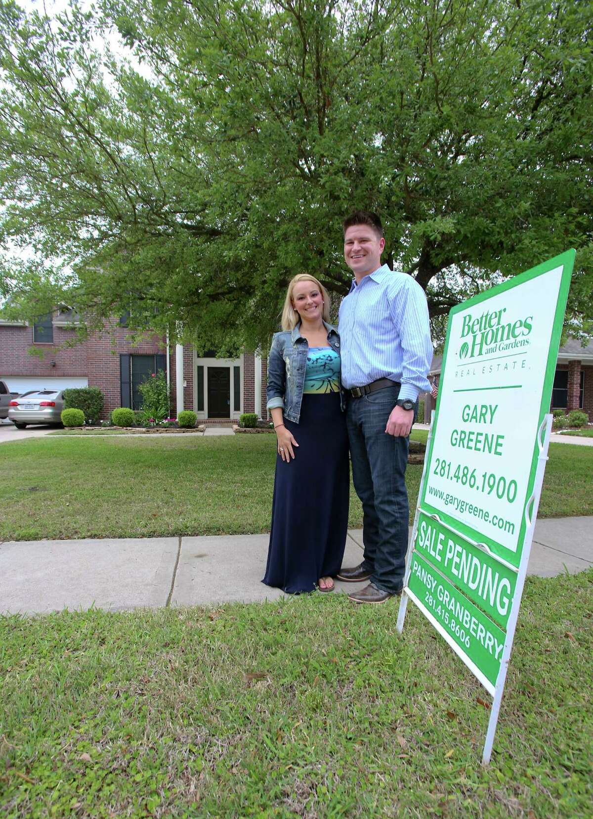 4/9/13: Nathan Cloutier age 33 and girlfriend Christina Aten age 28 in front of their newly purchased home in Pearland, Texas. Nathan is part of a young generation of buyers that are taking the leap into homeownership The two moved from an apartment in Clear Lake, Texas.