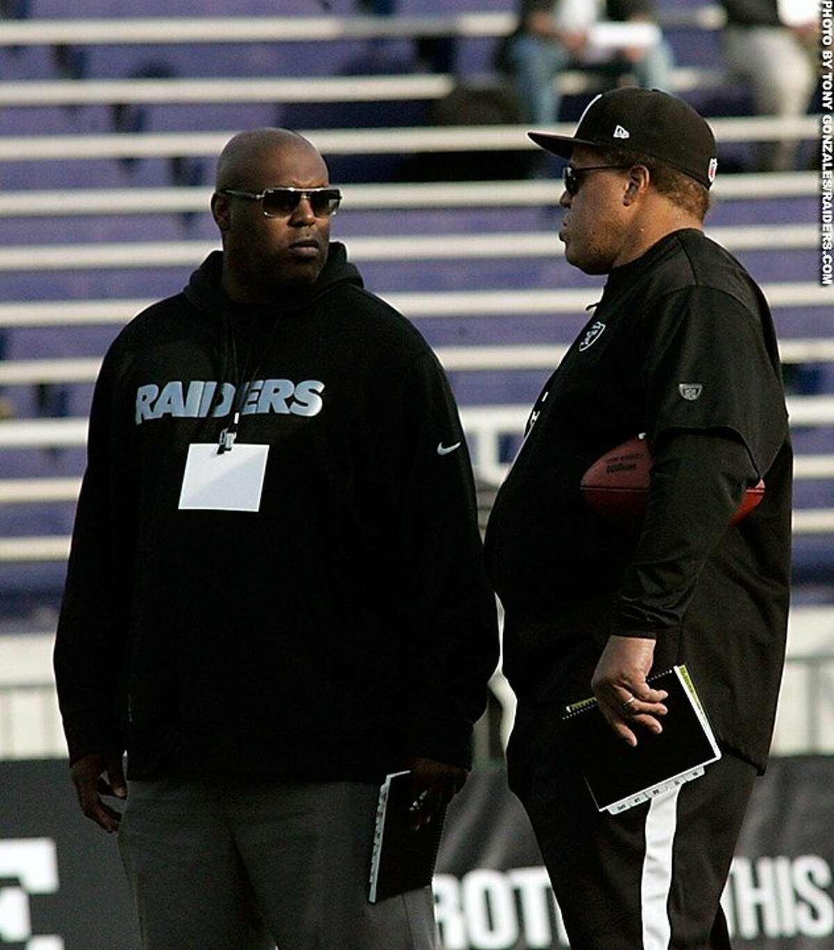 New raiders director of player personnel Joey Clinkscales, left, talks with GM Reggie McKenzie at the Senior Bowl.