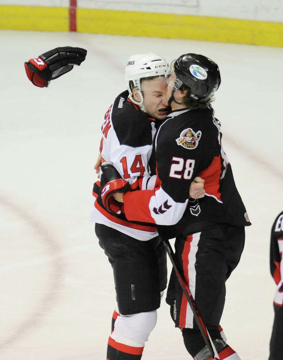 Binghamton Senators' Darren Kramer (28) and Albany Devils' Cam Janssen (14) fight during the first period of an AHL hockey game in Albany, N.Y., Saturday, April 13, 2013. (Hans Pennink / Special to the Times Union)