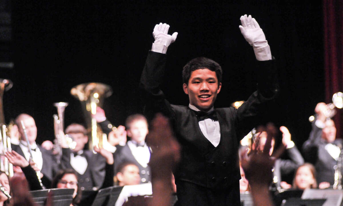 Churchill High School drum major Alex Bi leads the band as it was announced that they would march in the 2014 Macy's Thanksgiving Day Parade in New York City.