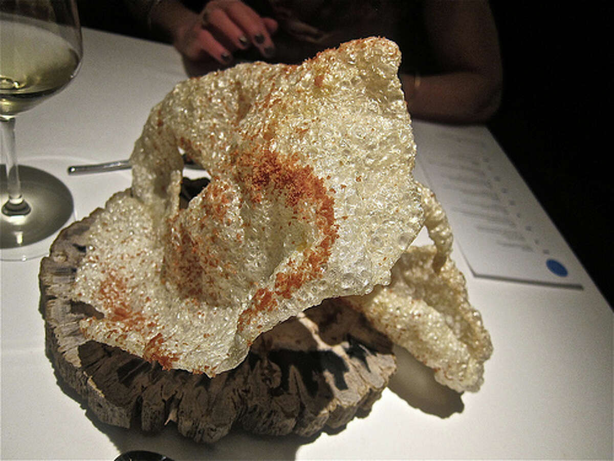 Monster pork crackling with ham dust, part of the "Ham & Eggs" caviar service at The Pass . Photo by Alison Cook