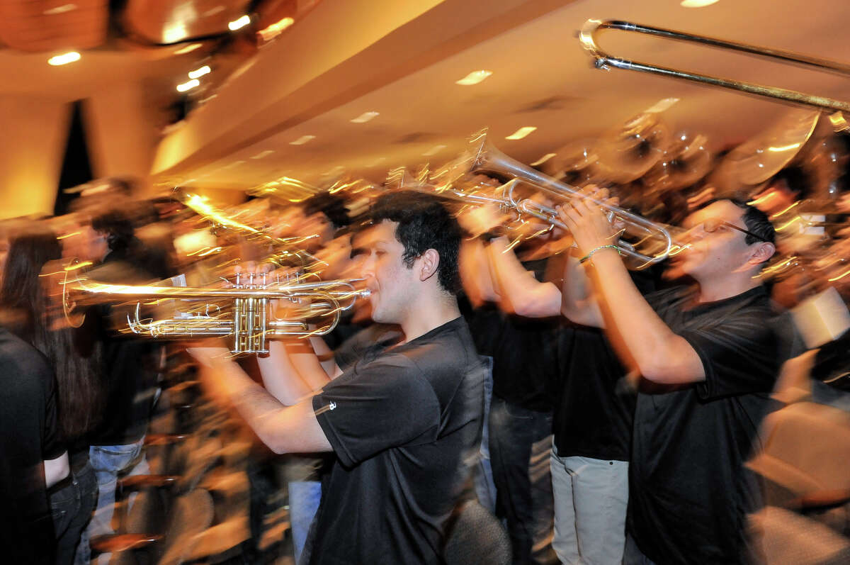 Churchill Band members Jeremiah Laija (left) and Clarence Canizalez play as it was announced Monday that the band would march in the 2014 Macy's Thanksgiving Day Parade.