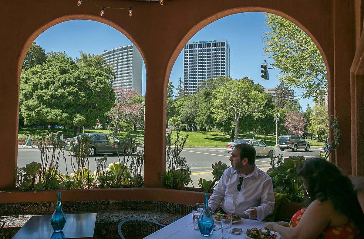 A couple enjoys lunch on the patio at Bacheesos restaurant in Oakland, Calif. on Wednesday, April 10th, 2013.