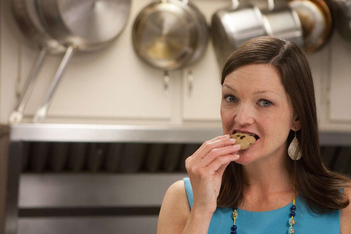 Lisa Pounds of Green Plate Kitchen samples one of her company's zucchini chocoloate chip cookies. GPK foods often contain vegetables in the food, she said.