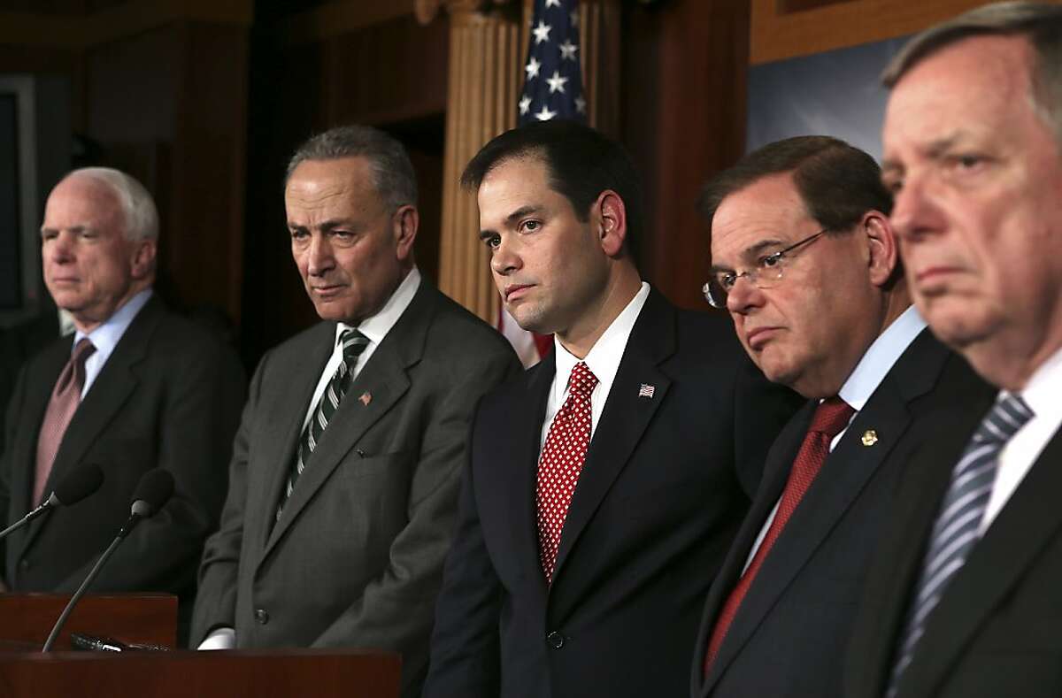 FILE -- Five of the eight bipartisan senators who are working on an immigration bill speak to reporters during a news conference in Washington, Jan. 28, 2013. The bill that the eight senators filed Tuesday, April 16, is one of intense across-the-aisle bargaining in an age when compromise is hard to reach. From left: Sens. John McCain (R-Ariz.), Chuck Schumer (D-N.Y.) Marco Rubio (R-Fla.) Robert Menendez (D-N.J.) and Dick Durbin (D-Ill.) (Doug Mills/The New York Times)