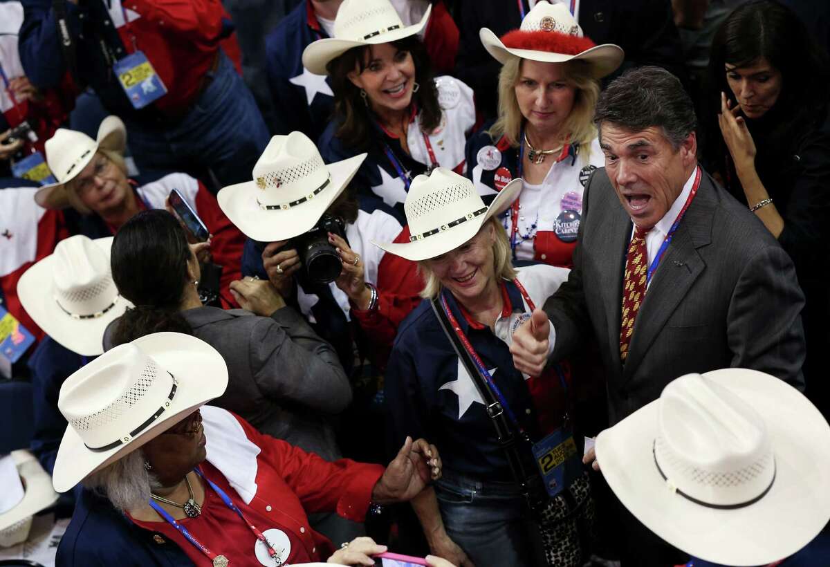 Texas Gov. Rick Perry (R) greets the delegation fron Texas during the Republican National Convention at the Tampa Bay Times Forum on August 28, 2012 in Tampa, Florida. Today is the first full session of the RNC after the start was delayed due to Tropical Storm Isaac.