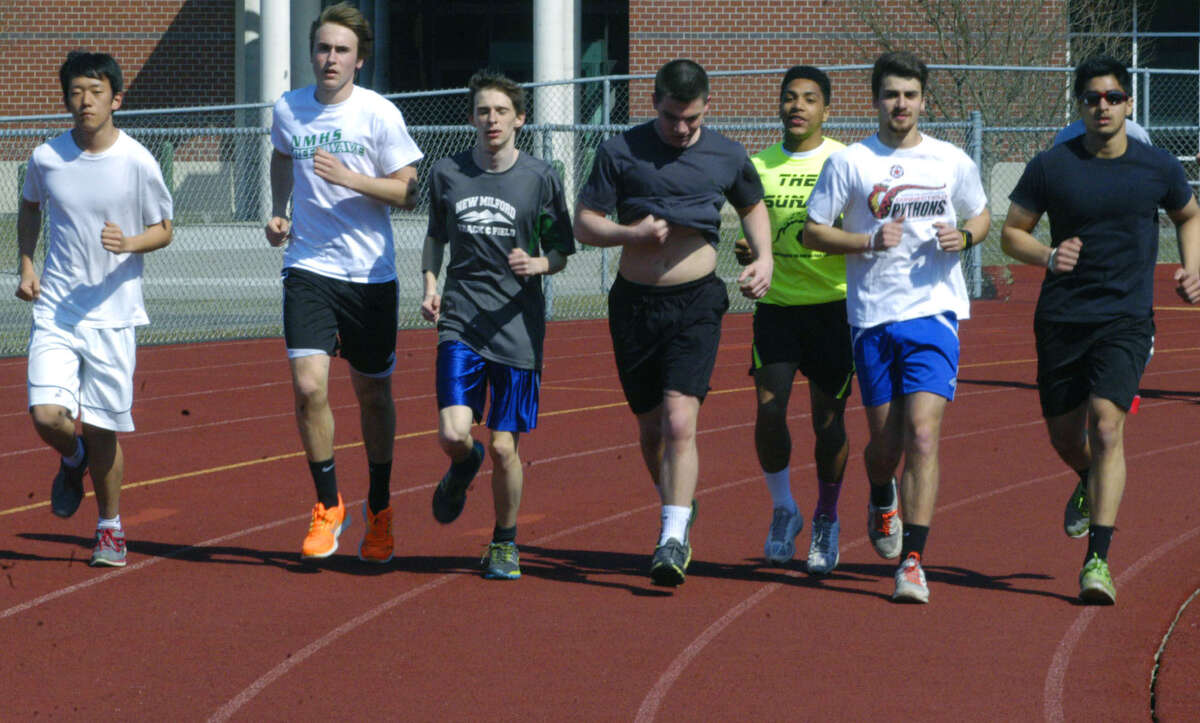 Green Wave athletes, from left to right, Jed Kang, Dennis Rafferty, Richard Grudzwick, Ryan Grenier, Jez Vazquez, Jordan Branco and Josh Kainth, warm up for a pre-season practice in preparation for the New Milford HIgh School boys' track season, April 2013