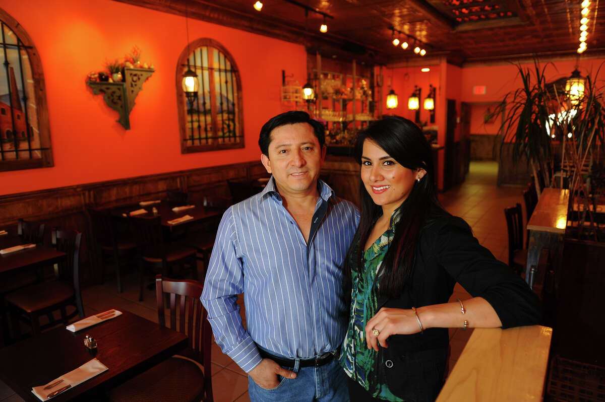 Hacienda Villa owners Alvino Villa and Jessica Nunez pose inside the restaurant which is located on Fairfield Avenue in Bridgeport, Conn. on Wednesday April 17, 2013.