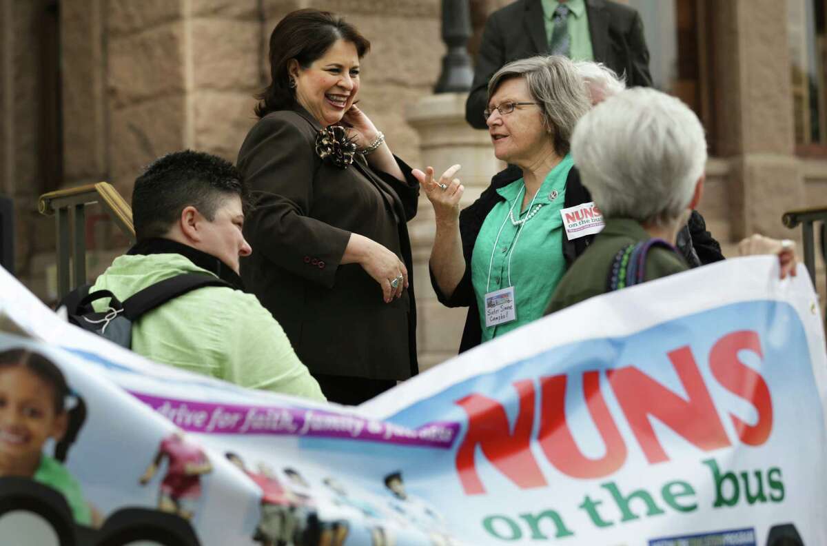 Texas State Senator Leticia Van De Putte, left, meets with Sister Simone Campbell, right, of NETWORK on the south steps of the Texas Capitol. Close to 200 nuns from San Antonio, Houston, Corpus Christi, Fort Worth and their friends, marched to the south steps of the Texas Capitol in Austin, TX to voice their support for the Medicaid expansion on Wednesday April 17, 2013.