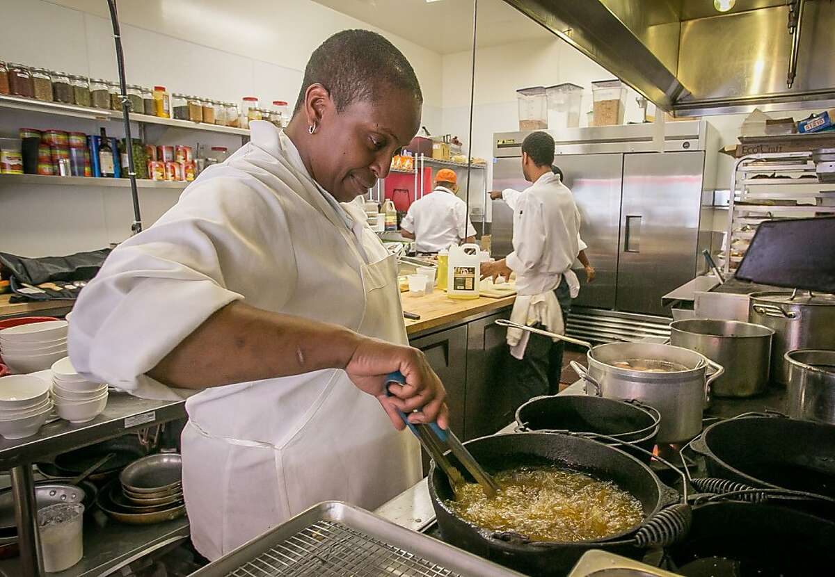 Chef/owner Sarah Kirnon cooks fried chicken at Miss Ollie's in Oakland, Calif., on Thursday, April 11th, 2013.