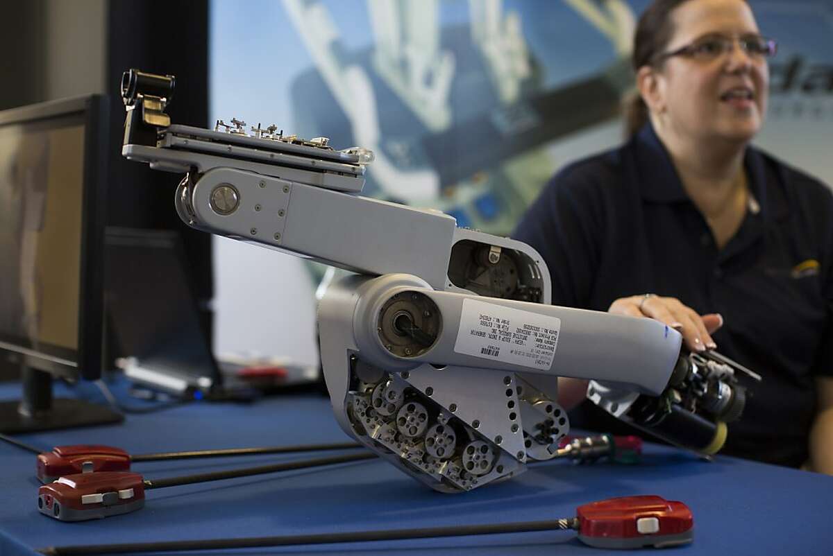 A robotic arm of a da Vinci surgical system by Intuitive Surgical on display during Silicon Valley Robot Block Party 2013 in celebration of National Robotics Week at Automotive Innovation Facility in Stanford, Calif. on Wednesday, April 10, 2013.