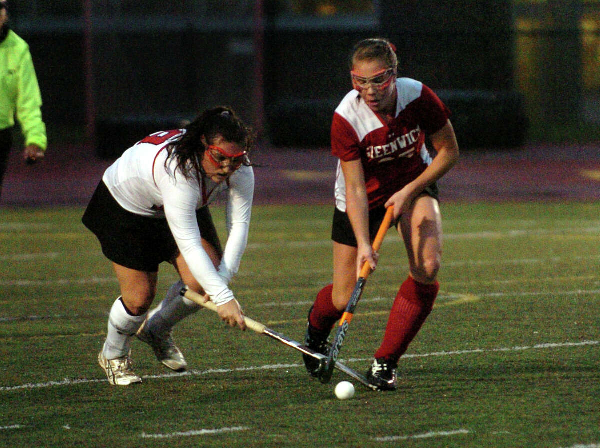 Greenwich's Nicole Graham, right, intercepts the ball from Cheshire's Anna Marcucilli in the 2011 CIAC Girls' Field Hockey Class L Semifinal in Fairfield, Conn. on Wednesday November 16, 2011
