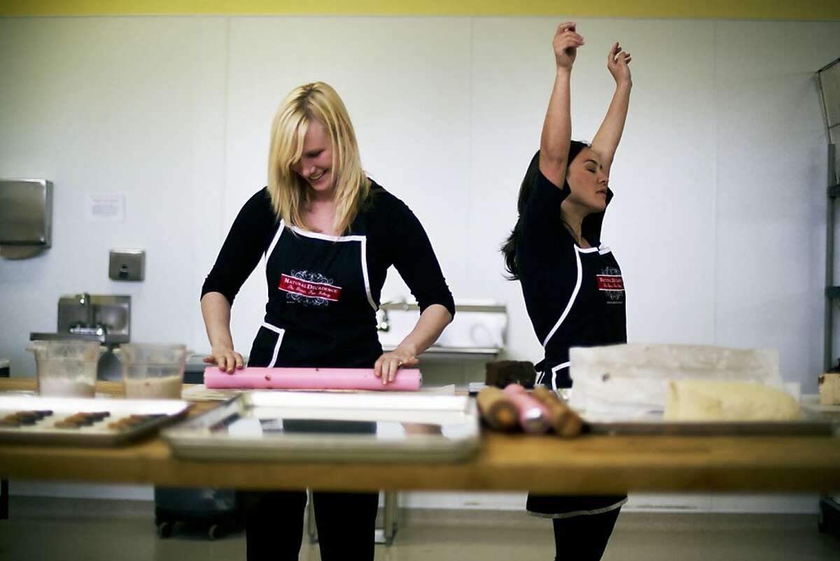 Rosa Dixon, 33, left, and Milia Lando, 36, right, co-owners of a local Humboldt County owned bakery called Natural Decadence are seen in their kitchen preparing baked goods. They started the business in October of 2011. Natural Decadence is a wholesale bakery that's gluten free, egg free, dairy free and nut free.