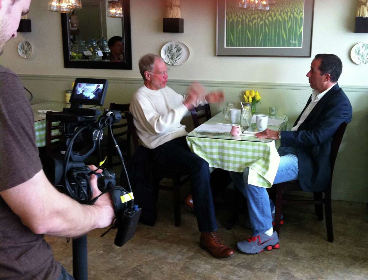 David Letterman and Jerry Seinfeld sit together at Green Granary on Railroad Street, in New Milford, Conn., where the two were filmed for a spot on Seinfeld's show, "Comedians In Cars Getting Coffee," Friday, April 19, 2013.