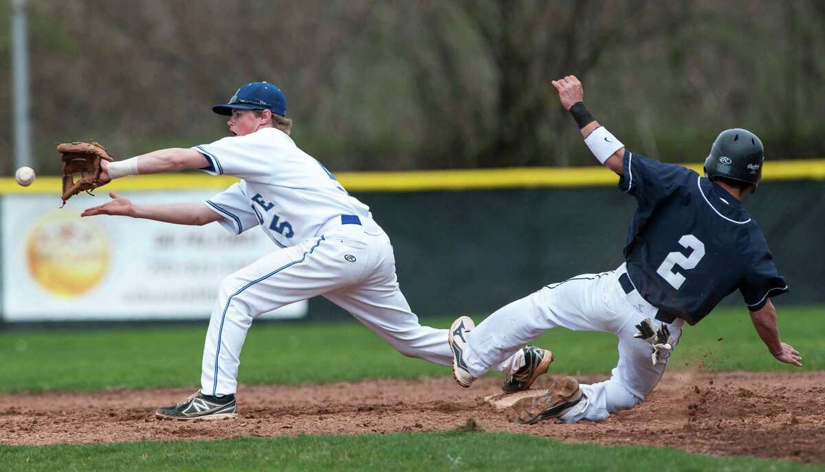 Fairfield Ludlowe high school's Tom Ryan gets the throw in time to get Staples high school's Matt Campbell out at second during a baseball game played at Kiwanis field, Fairfield, CT on Friday April 19th, 2013.