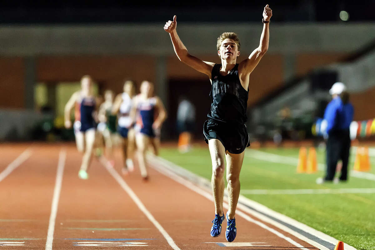 Clark's Austin Wells celebrates as he crosses the finish line in the boys 1600-meter run during the area 25-5A/26-5A and 27-5A/28-5A track meet at Heroes Stadium on Friday, April 19, 2013. Clark won the event in the 27-5A/28-5A meet with a time of4:21.93 and also took first place in the 3200-meter run. MARVIN PFEIFFER/ mpfeiffer@express-news.net