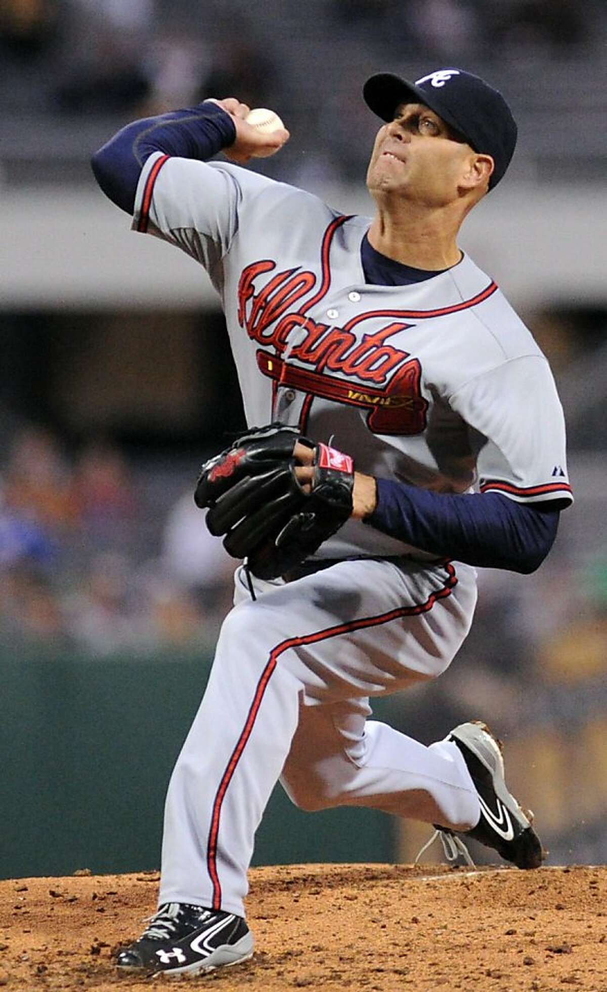 Atlanta Braves starting pitcher Tim Hudson throws in the third inning of a baseball game against the Pittsburgh Pirates at PNC Park, Friday, April 20, 2013, in Pittsburgh. (AP Photo/John Heller)