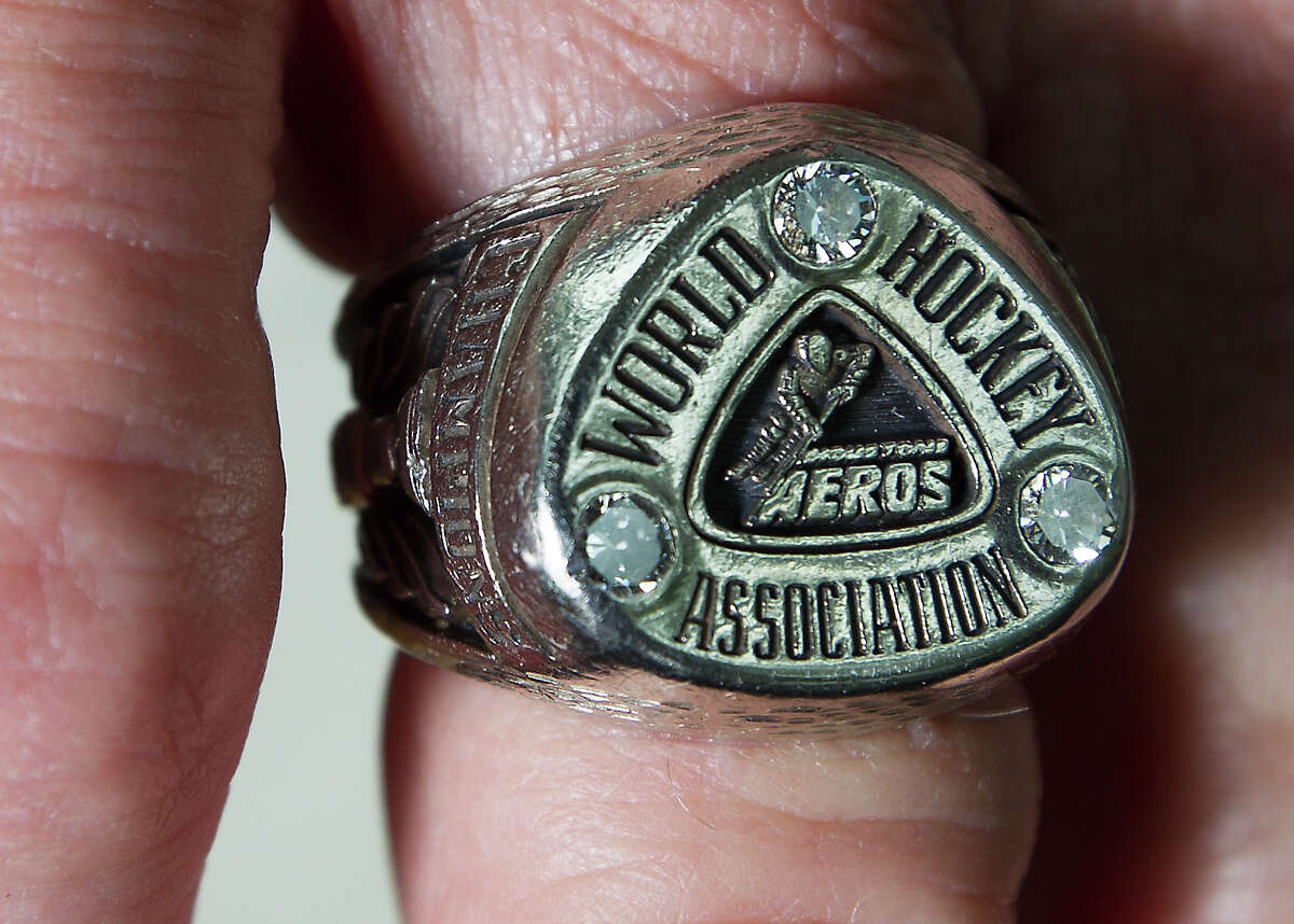 Former Aero Jack Stanfield shows off his championship ring from the 1973-74 season on Friday, April 19, 2013, in Houston.