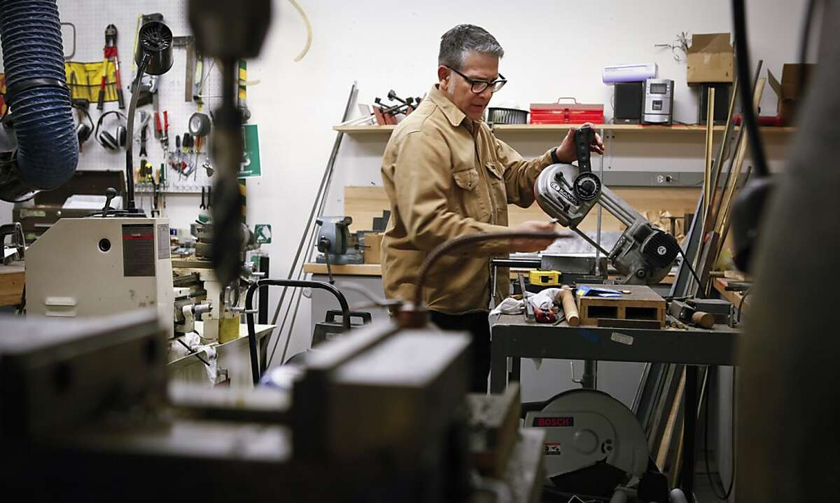 Vincent Avalos works on a mount for a Japanese piece on Tuesday, April 16, 2013 in San Francisco, Calif. Avalos is the mountmaker at the Asian Art Museum and is responsible for ensuring that each of the 2,000 objects on display will hold its ground in an earthquake.