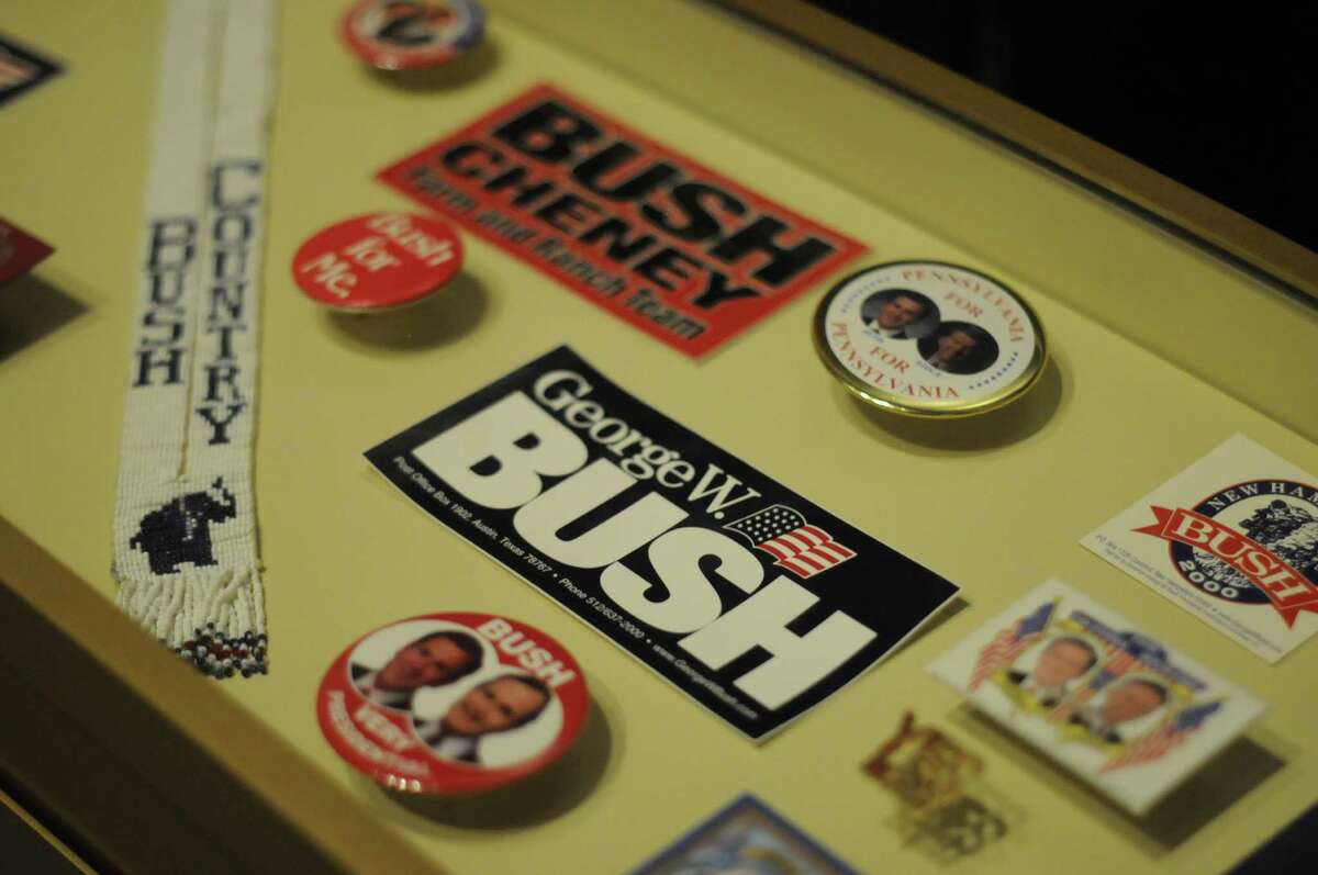 In this photo taken April 16, 2013, various campaign memorabilia is shown in the museum area at the George W. Bush Presidential Library and Museum in Dallas. The museum uses everything from news clips to interactive screens to artifacts to tell the story of Bush’s eight years in office. The George W. Bush Presidential Center, which includes the library and museum along with 43rd president’s policy institute, will be dedicated Thursday on the campus of Southern Methodist University in Dallas. (AP Photo/Benny Snyder)