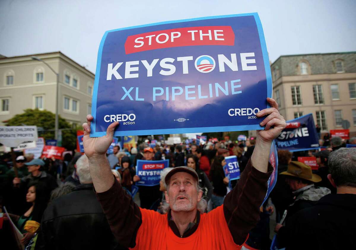 Demonstrator John McCullough makes his views known on the proposed Keystone XL pipeline from Canada. Environmentals say the diluted bitumen that would be carried by Keystone XL would be especially difficult to clean up.
