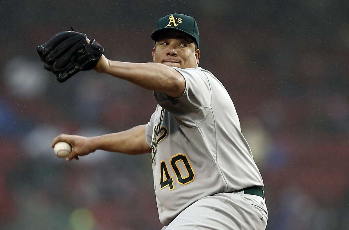 Oakland Athletics starting pitcher Bartolo Colon delivers against the Boston Red Sox during the first inning of a baseball game at Fenway Park in Boston on Tuesday, April 23, 2013. (AP Photo/Winslow Townson)