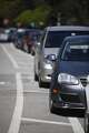 Some cars are seen parked on top of a striped buffer zone next to the bike lane along John F. Kennedy Drive in Golden Gate Park on Tuesday, April 23 2013 in San Francisco, Calif.