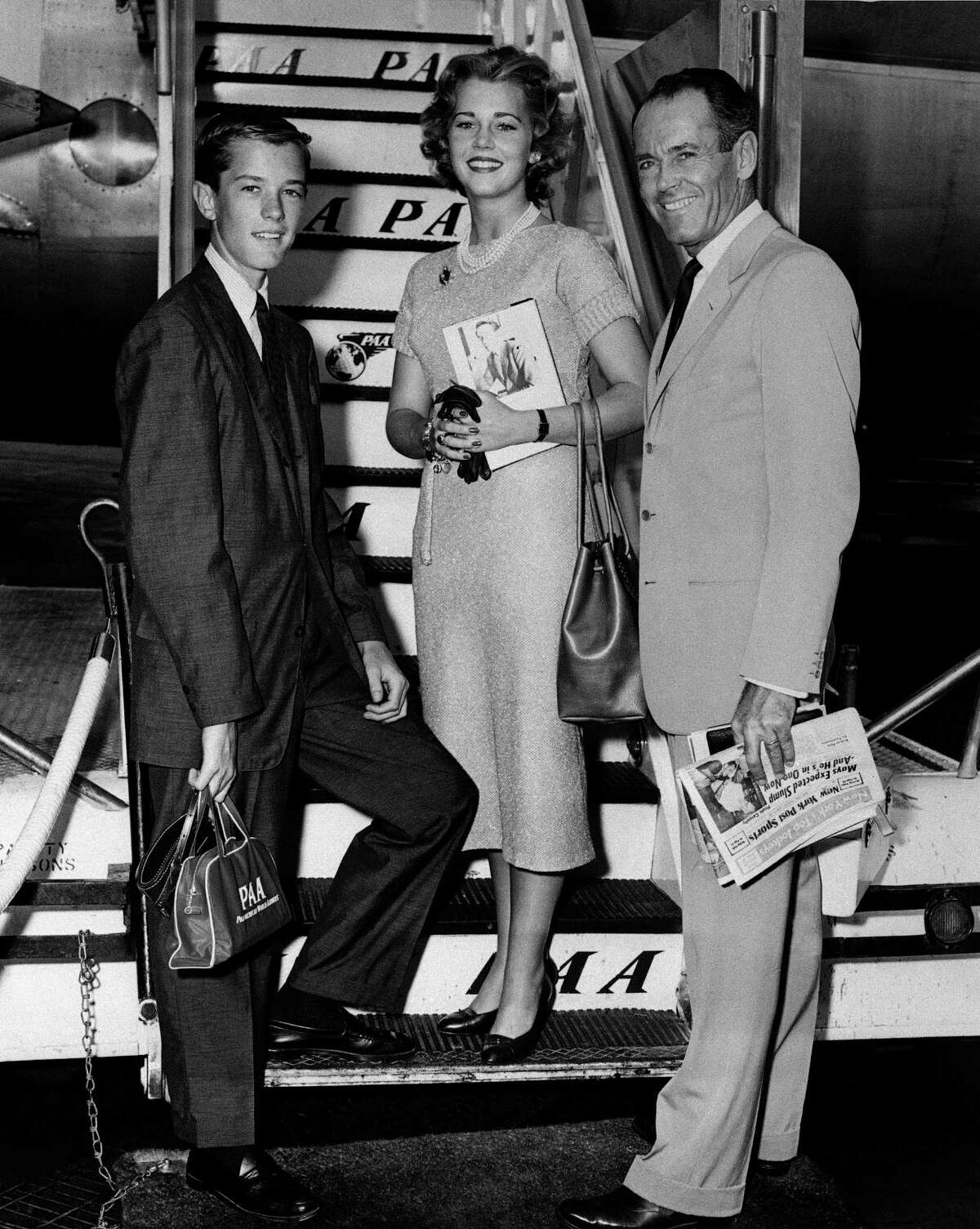 FILE - In this June 25, 1957 file photo, movie actor Henry Fonda, right, with his children, Jane and Peter, are shown at New York International Airport. (AP Photo, File) Photo: Uncredited