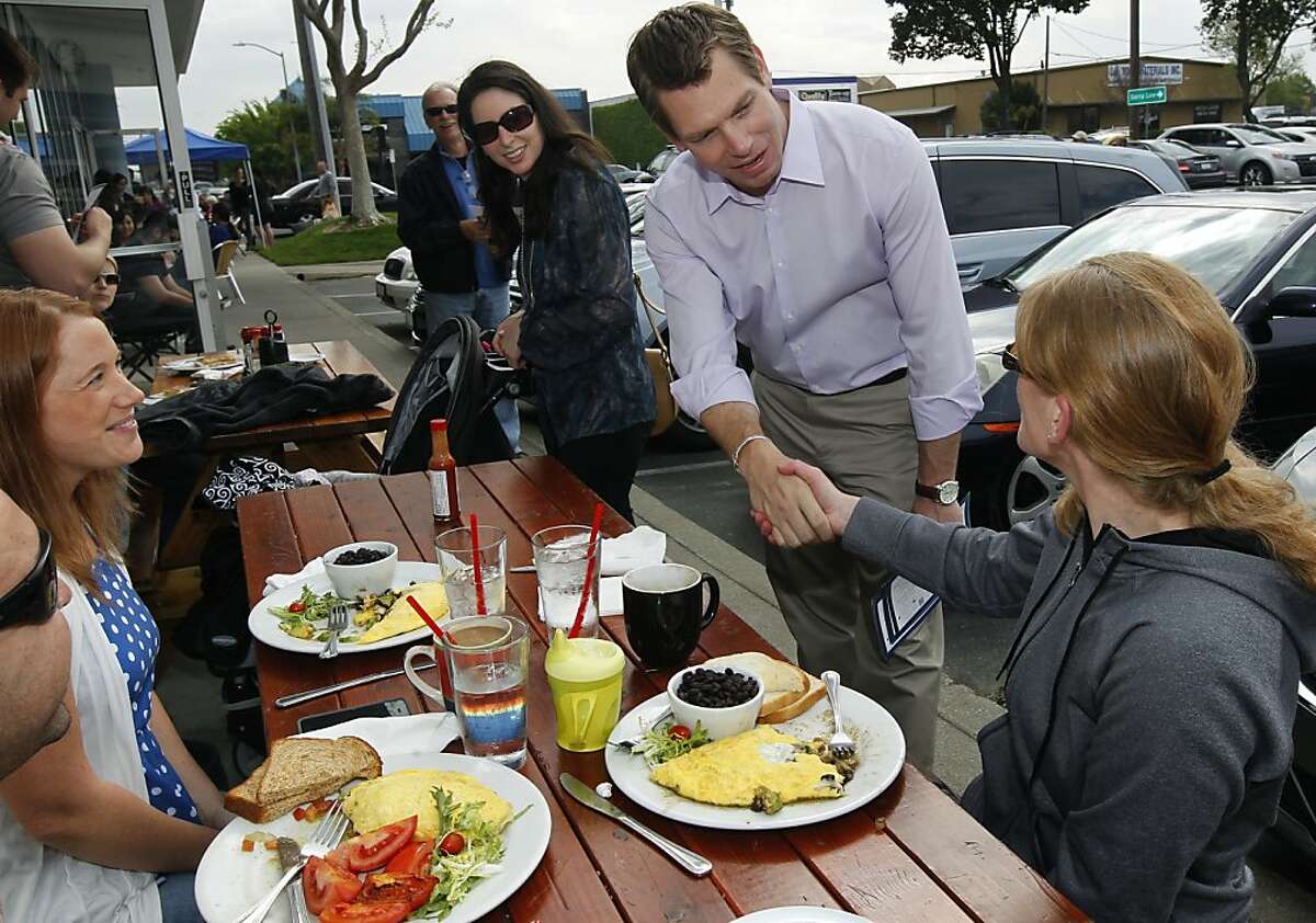 Rep. Eric Swalwell introduces himself to diners having breakfast at Denica's Pastry Cafe in Dublin, Calif. while meeting constituents of his congressional district on Saturday, March 30, 2013.