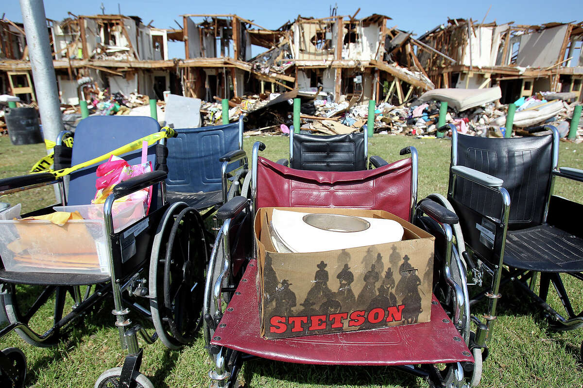 A Stetson hat rests on a wheelchair outside the apartment complex adjacent to the site of the fire and explosion in West, Texas on Wednesday, April 24, 2013.