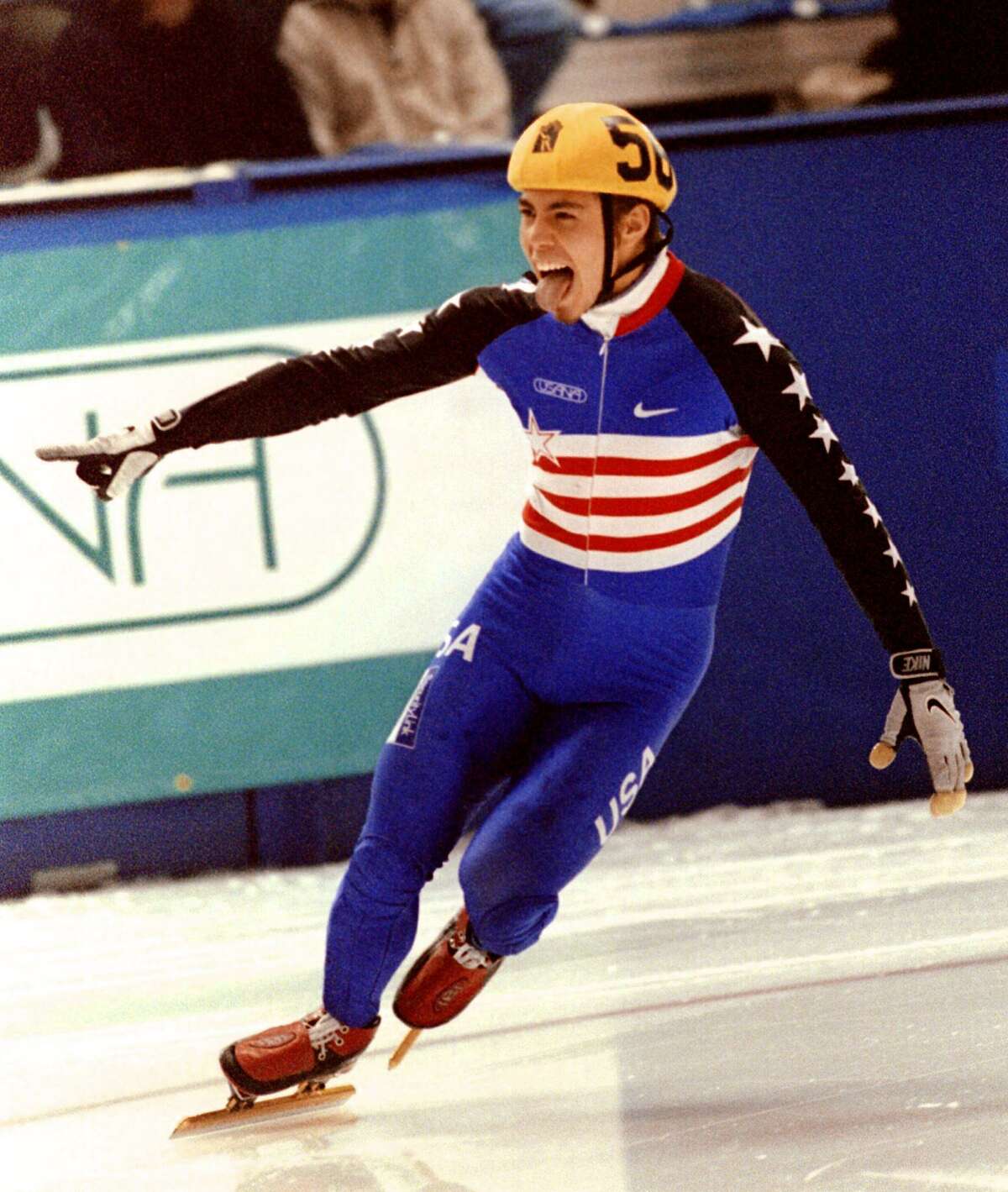 Apolo Anton Ohno of the US celebrates winning the men's 500-meter World Cup short track speedskating event Oct. 21, 2000 in Calgary, Alberta.