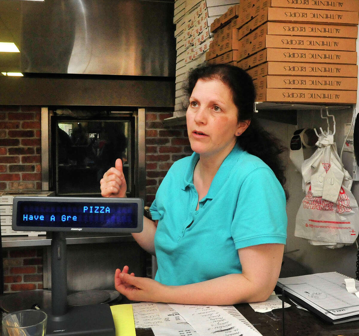 Maria Garell, owner of John's Best Pizza, talks about the Ridgefield Planning and Zoning Commission studying a zoning change that would allow retail development along Route 7 from Route 35 north to the Danbury, Conn., town line. Photographed Thursday, April 25, 2013.