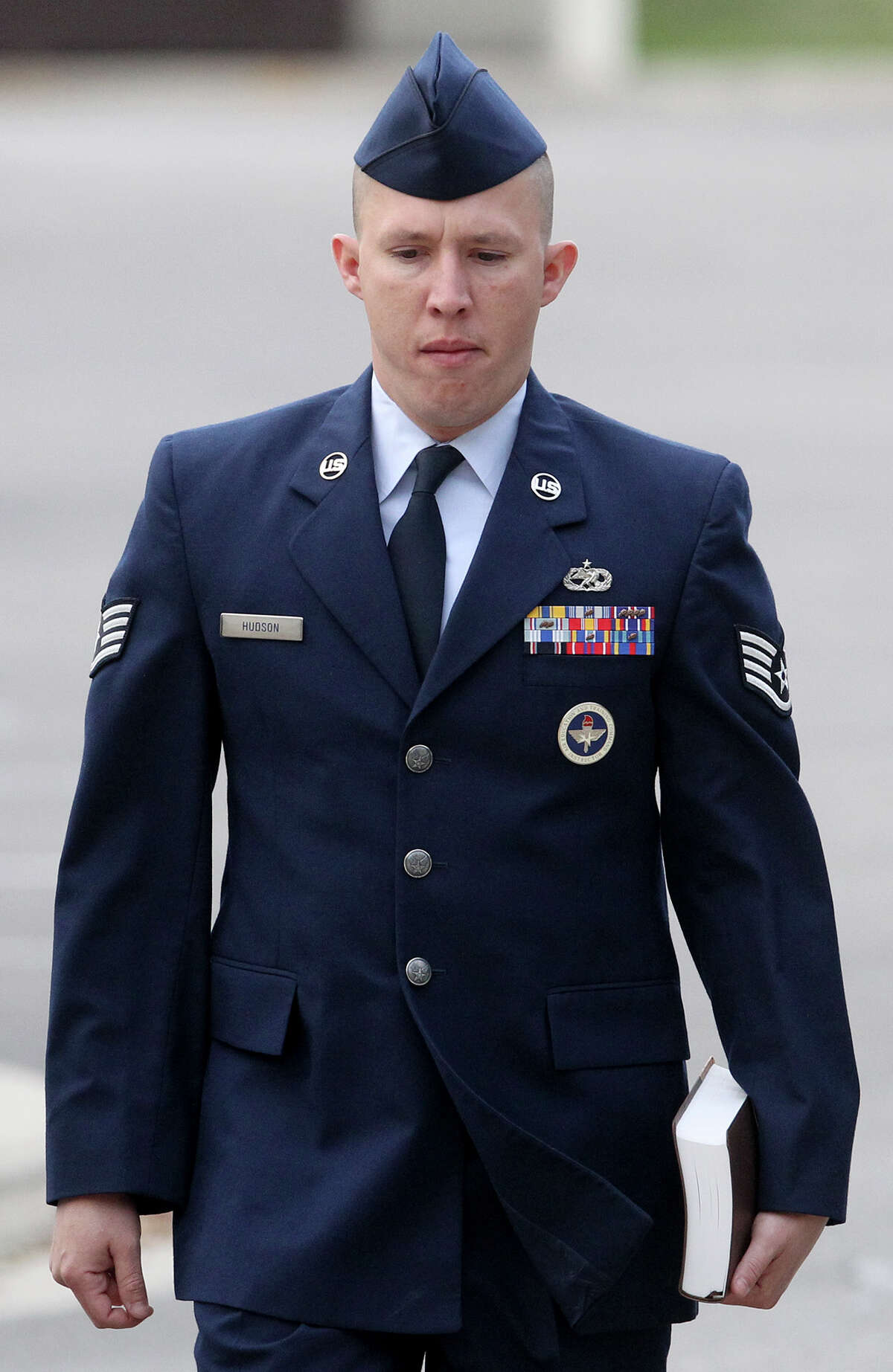 U.S. Air Force Staff Sergeant Robert Hudson walks at Joint Base San Antonio-Lackland Thursday April 25, 2013. The training instructor is accused of having sex with a technical school trainee and other charges.