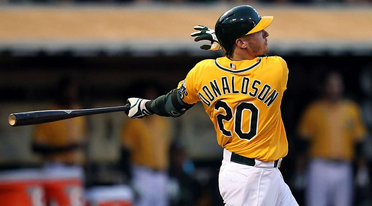 Oakland Athletics Josh Donaldson watches his two run double hit the wall in center field during their MLB baseball game with the Baltimore Orioles Thursday, April 25, 2013 in Oakland, Calif.