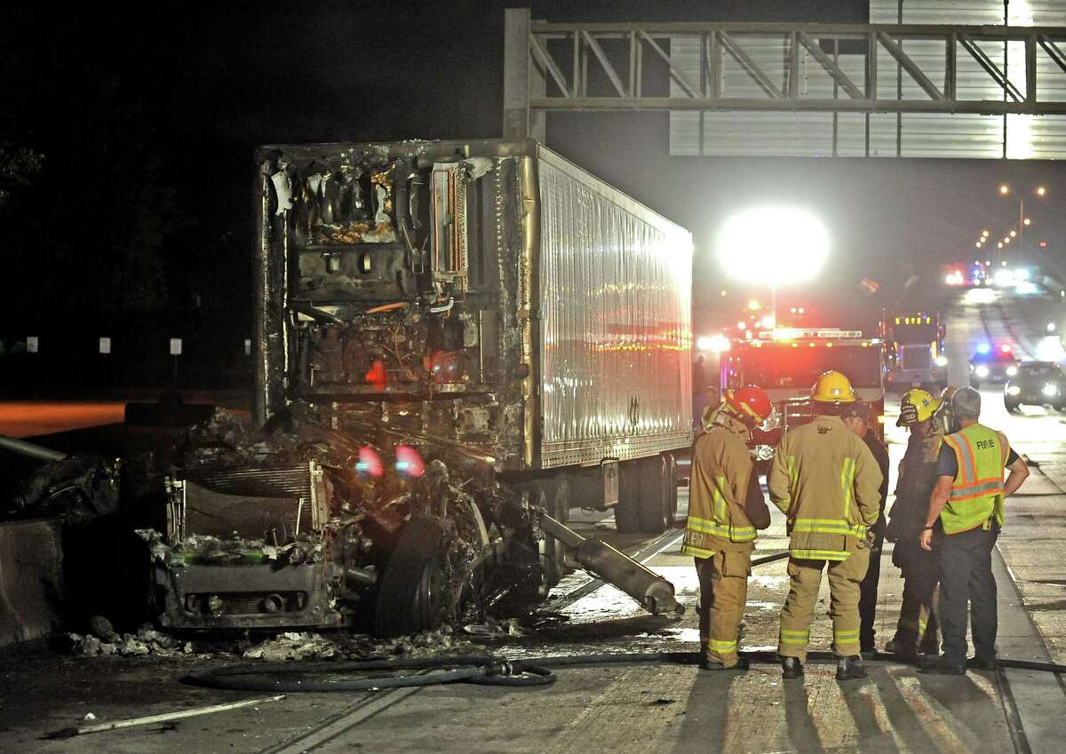 An eighteen-wheeler caught fire in the west bound lane of Interstate 10 near the Martin Luther King Boulevard exit after nine o'clock on Thursday, April 25, 2013. The cause of the fire is undetermined at the moment. Photo taken: Randy Edwards/The Enterprise