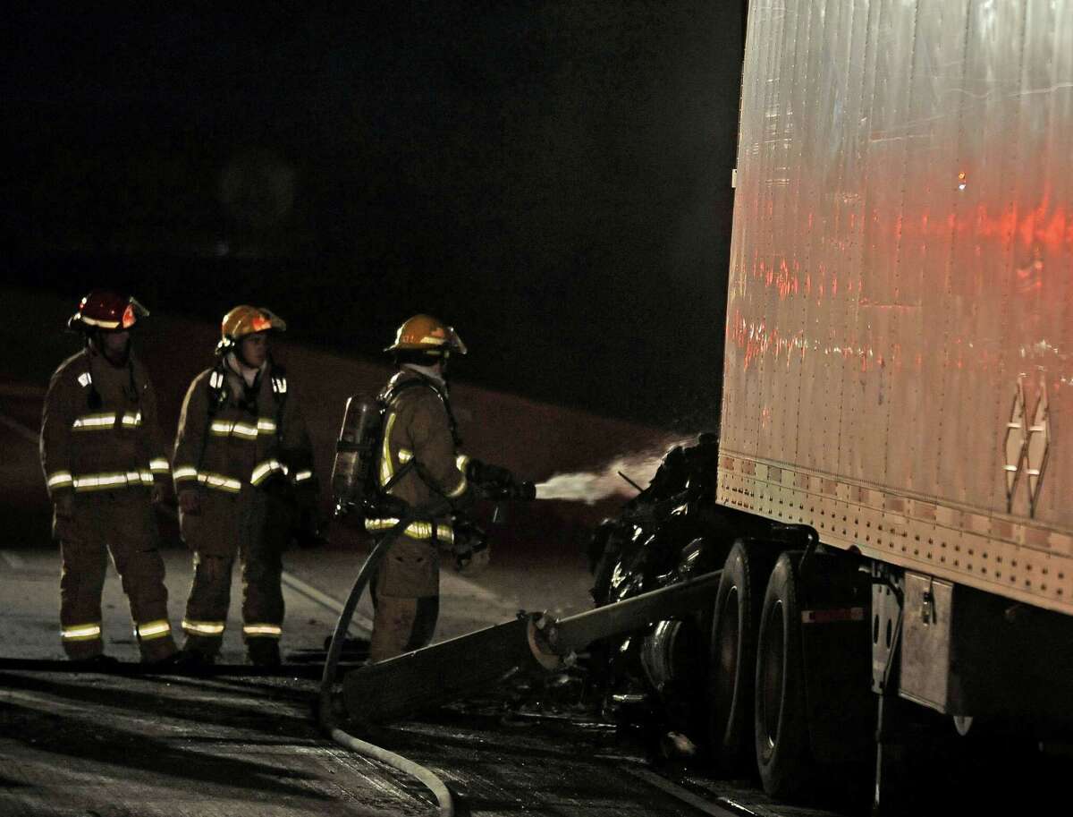 An eighteen-wheeler caught fire in the east bound lane of Interstate 10 near the Martin Luther King Boulevard exit after nine o'clock on Thursday, April 25, 2013. The cause of the fire is undetermined at the moment. Photo taken: Randy Edwards/The Enterprise