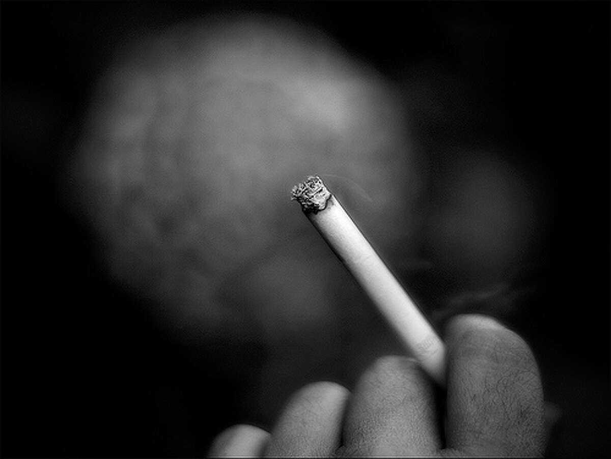 10. Smoking related (includes smoking, lighting up, putting ashes in ashtray), 1% percent of distracted drivers. Photo: Ferran., Flickr Source: Erie Insurance Group