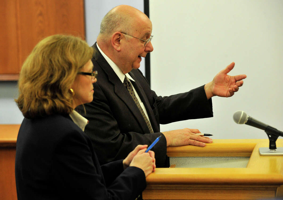 Assistant State's Attorney Susann Gill, left, and defense attorney Hubert Santos talk to Judge Thomas Bishop at Michael Skakel's habeas corpus trial at State Superior Court in Vernon, Conn., on Friday, April 26, 2013.