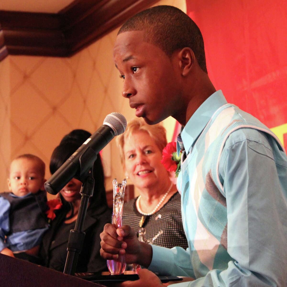Jonathan Dorvill of Stamford explains how he and his sister Rashidah saved their baby brother, who had stopped breathing. The siblings were among the honorees at the American Red Cross "heroes'' breakfast Friday morning at the Trumbull Marriott.