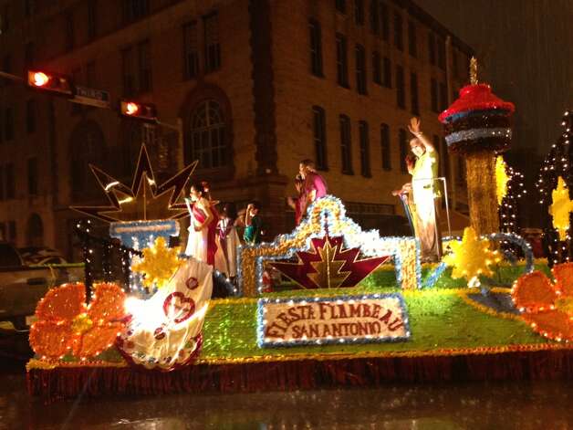 A Float Braves The Rain At The Fiesta Flambeau Parade On
