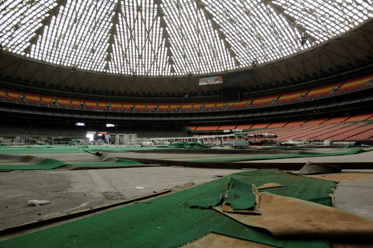 Pieces of AstroTurf lay across the stadium floor shown during a media tour of the Reliant Astrodome Thursday, March 21, 2013. Renovation costs for the Reliant Astrodome would be around $270 million.