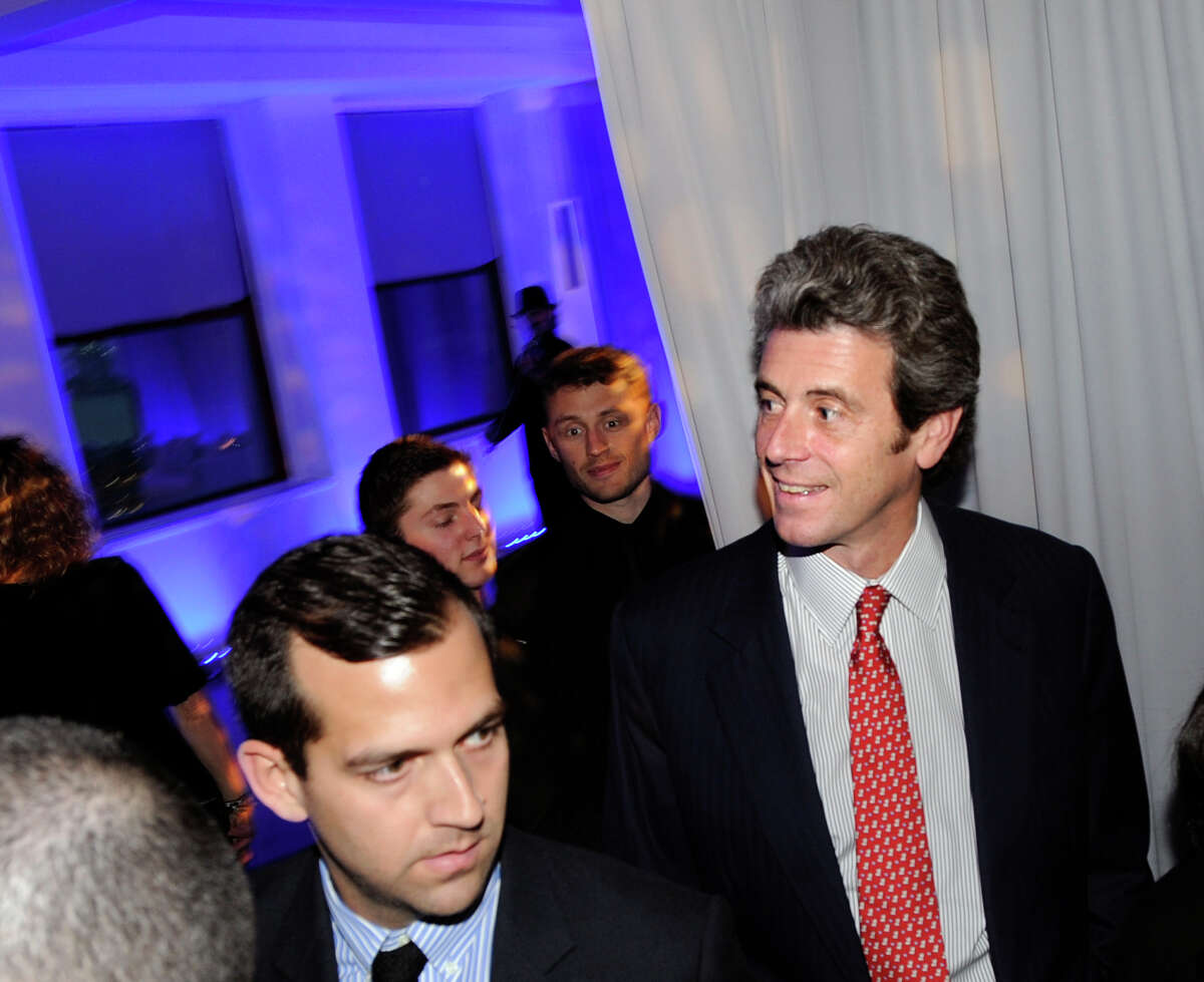 Tony Malkin, right, of Malkin Holdings LLC, smiles during the wedding reception of Greenwich residents Paula Cubero and Enrique Catter at the Empire State Building in New York City, Tuesday, Feb. 14, 2012.