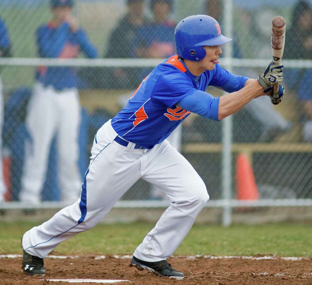Danbury High School's Nick Goetz sets himself to drag a bunt during a game against Ridgefield High School, played at Danbury. Monday, April 29, 2013