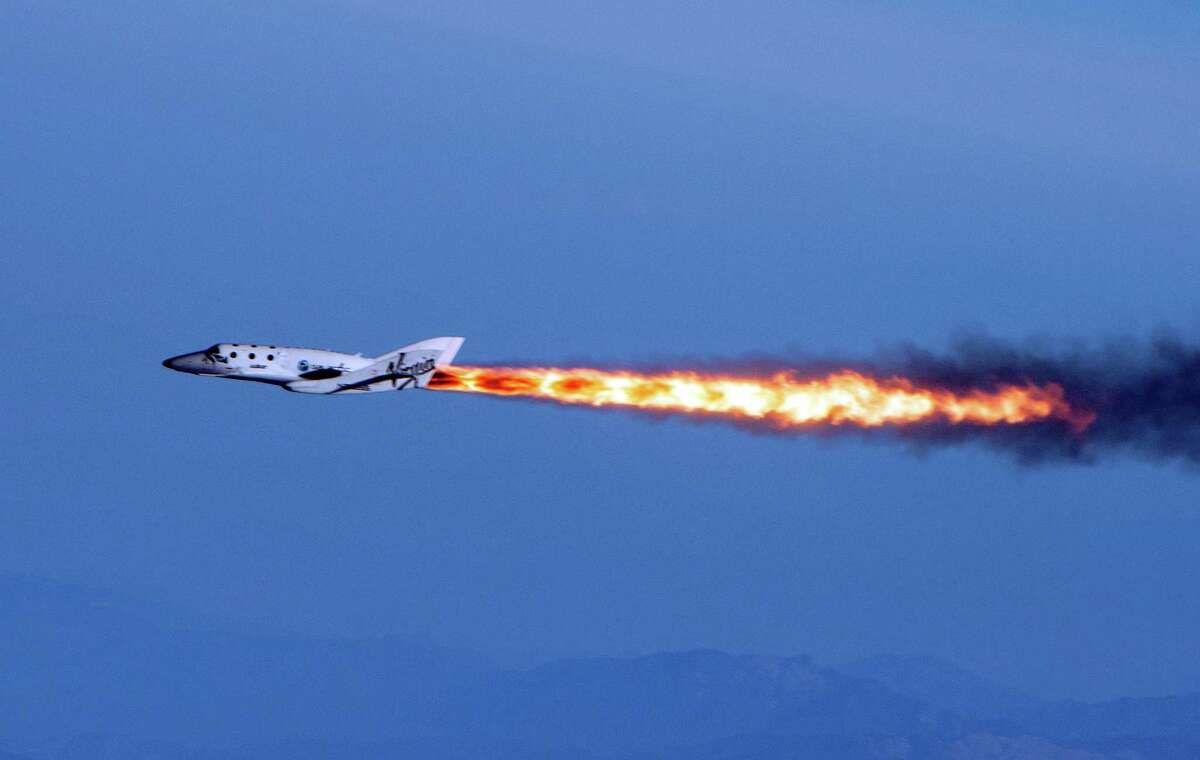 During a test flight, Virgin Galactic's SpaceShipTwo flies under rocket power for the first time since the program began in 2005.