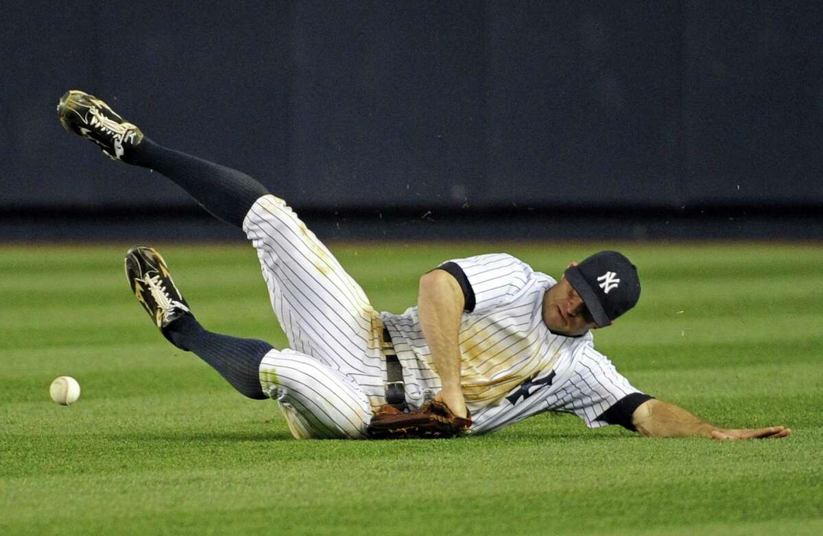 New York's Brett Gardner is unable to catch a single by Houston's Jose Altuve.