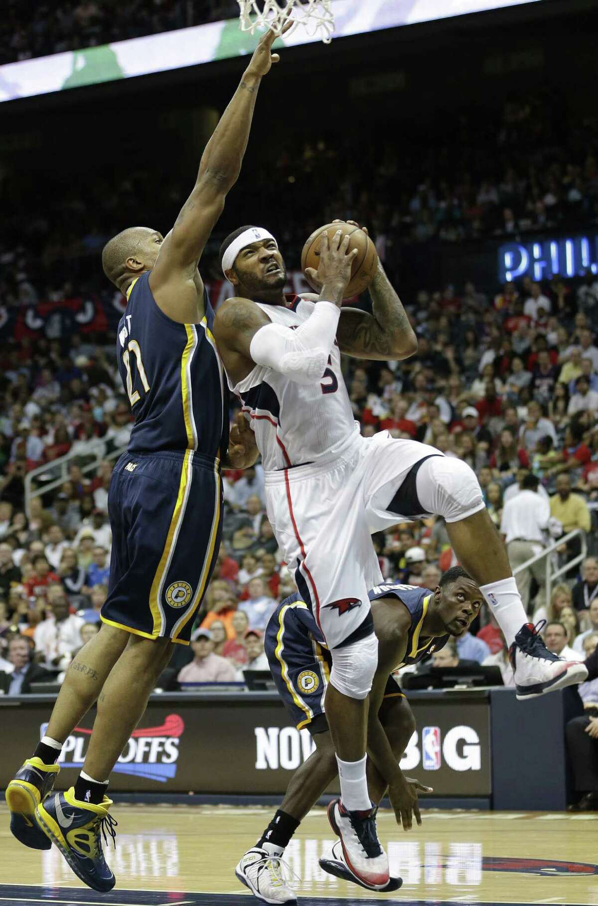 Atlanta's Josh Smith heads to the basket against Indiana's David West. Smith's career playoff high 29 points helped boost the Hawks into a 2-2 series tie.